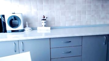 popular webcam model playing in the kitchen